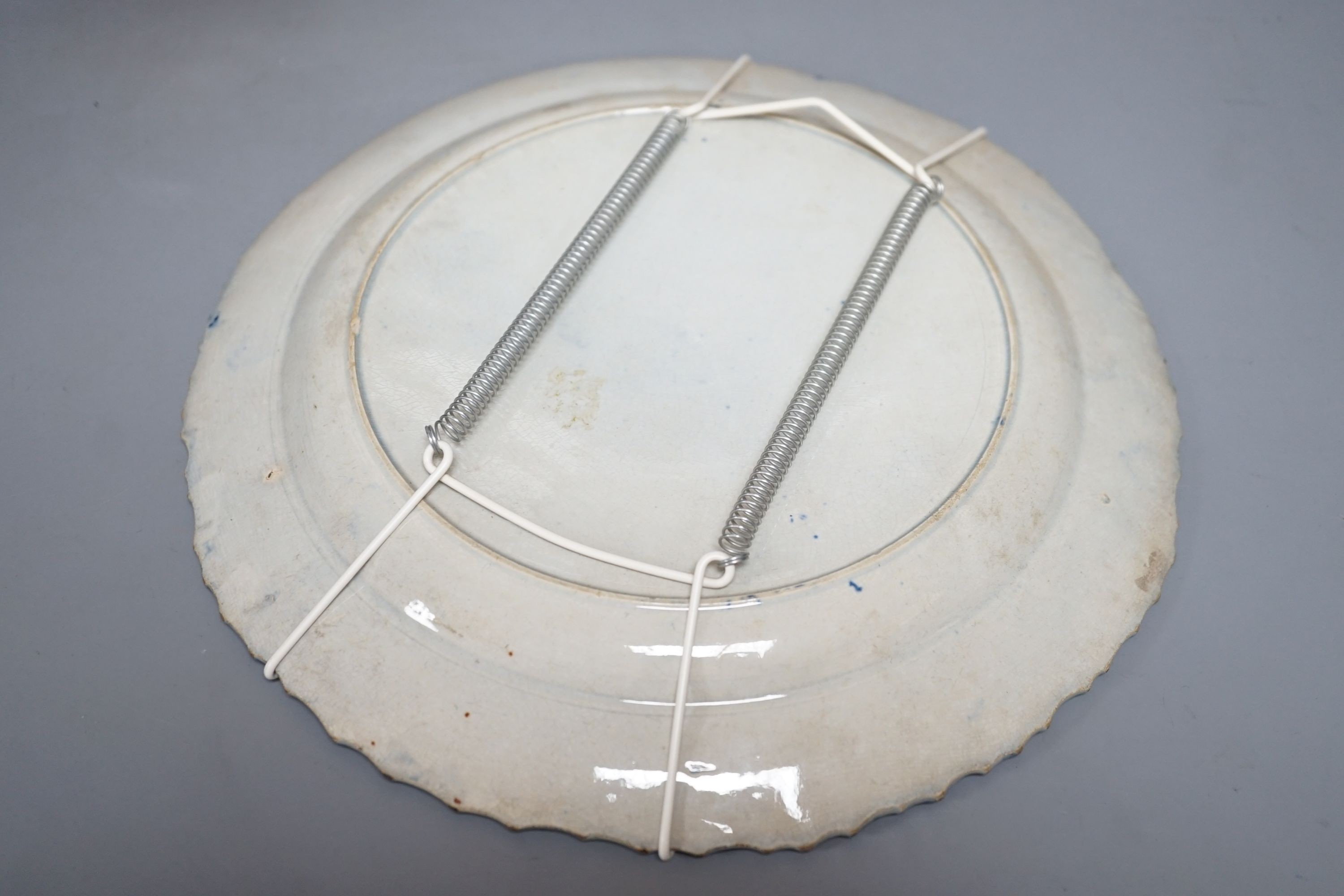 An early 19th century English pearlware plate and a Doulton Salisbury Gill jug, 11cm tall